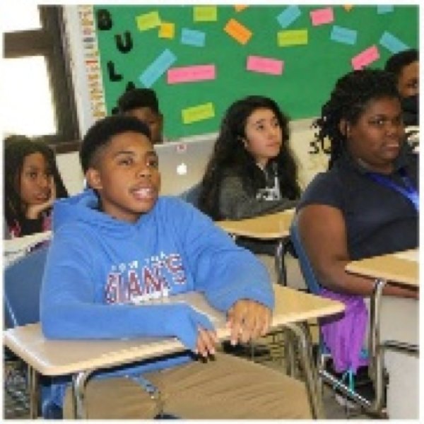 Student smiling in classroom